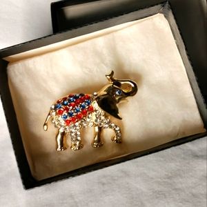 Red and blue gold tone elefant